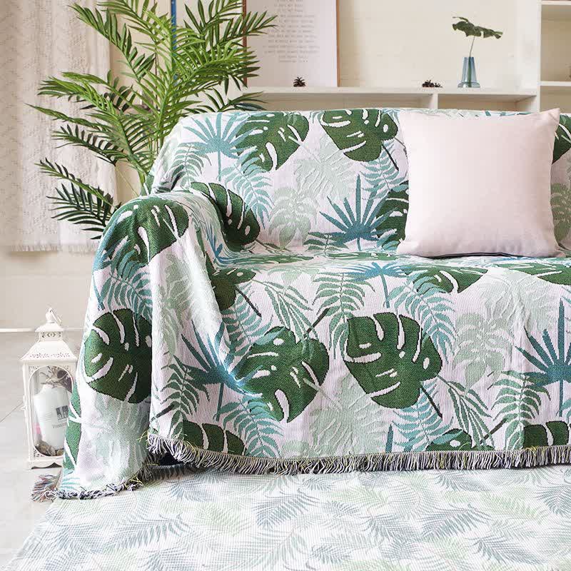 Dwustronny pokrowiec na kanapę z wzorem liści palmy i frędzlami